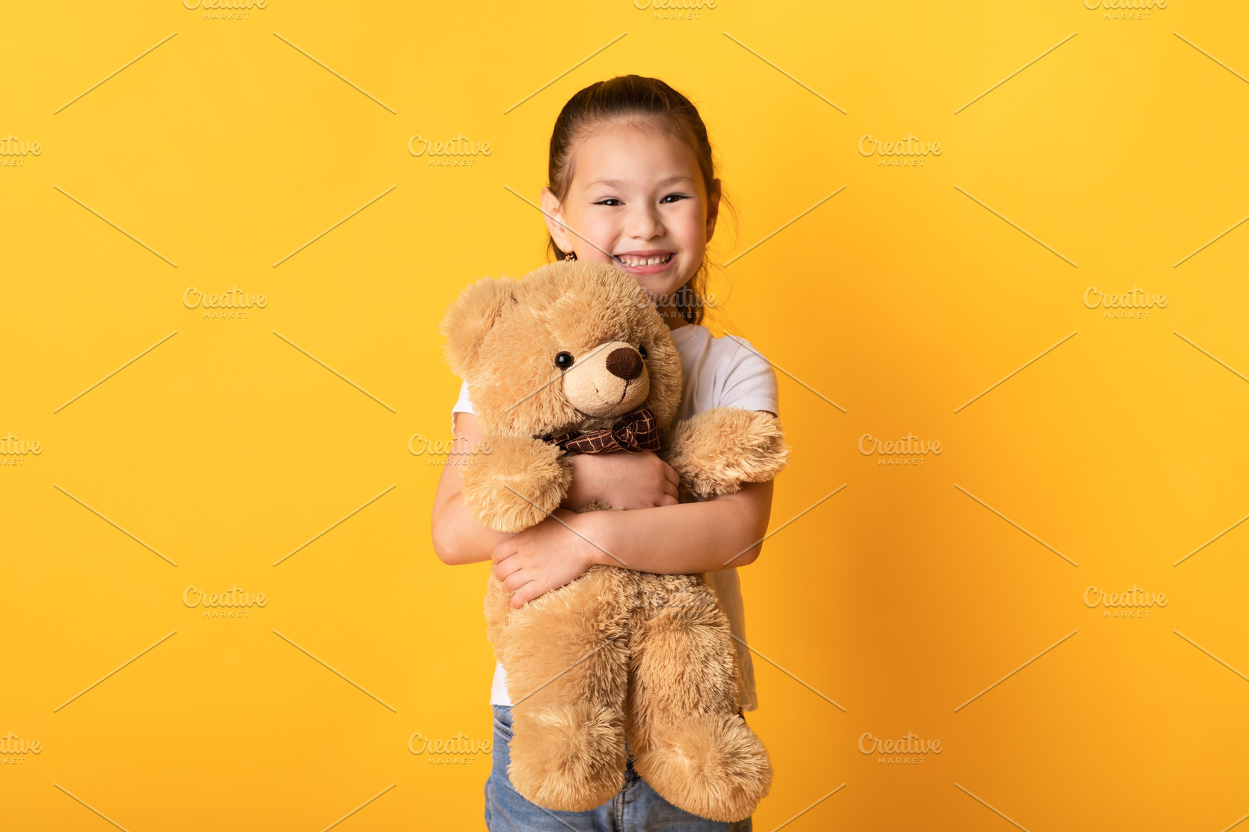 Little cute girl standing and holdin | Background Stock Photos ...