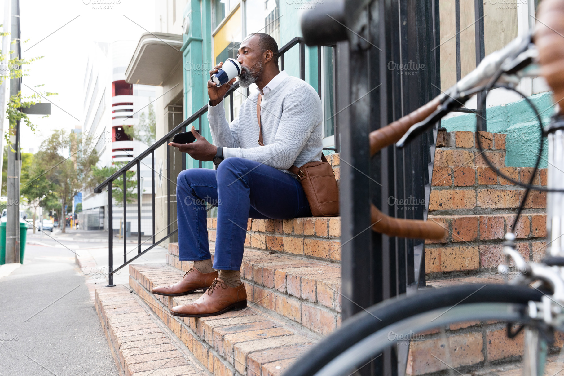 Man sitting on stairs | Stock Photos ~ Creative Market