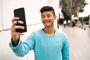 Asian man taking a selfie with his m featuring 20s, confident, and ...