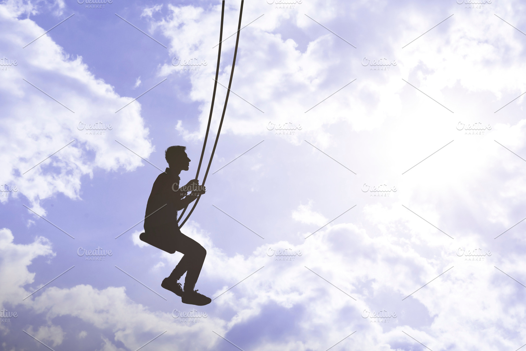 flying high in the sky with clouds, man on a swing, relax and dream in ...